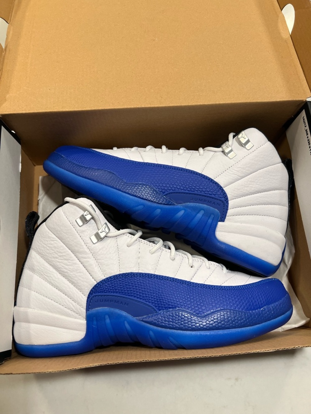 Jordan White and Royal Blue Retro 12 Sneakers
